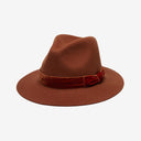 A brown fedora style hat made of brushed wool felt, featuring a velvet ribbon band and a tacked bow.